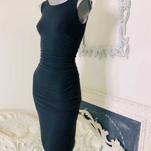 Norma Kamali
Sleeveless Shirred Waist Dress
